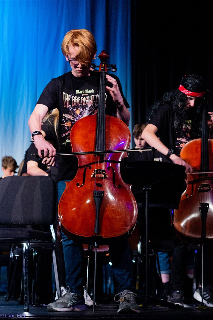 Orchestra students perform onstage